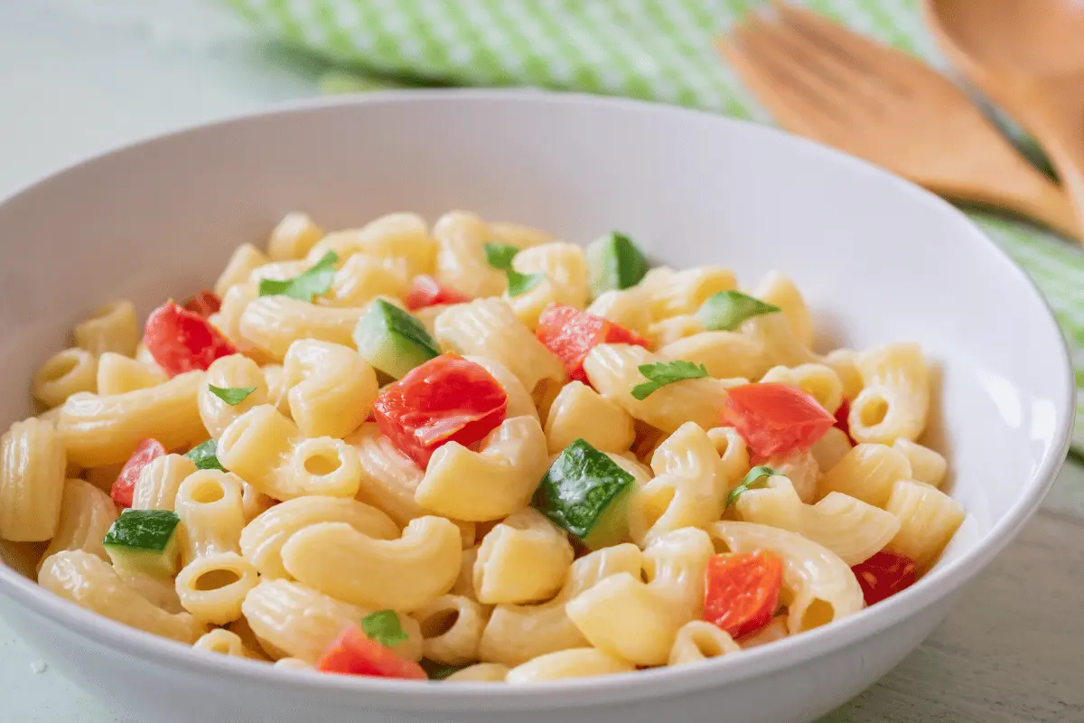 Pasta salad served in a bowl, ideal for outdoor dining.