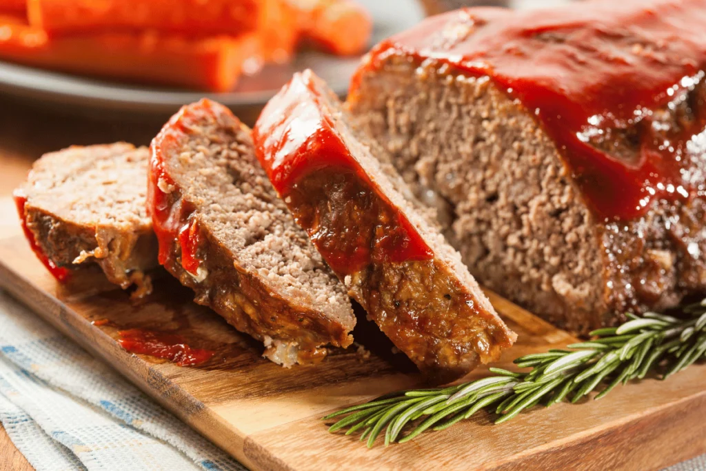A mouthwatering smoked meatloaf, fresh out of the grill, showcasing its savory aroma.