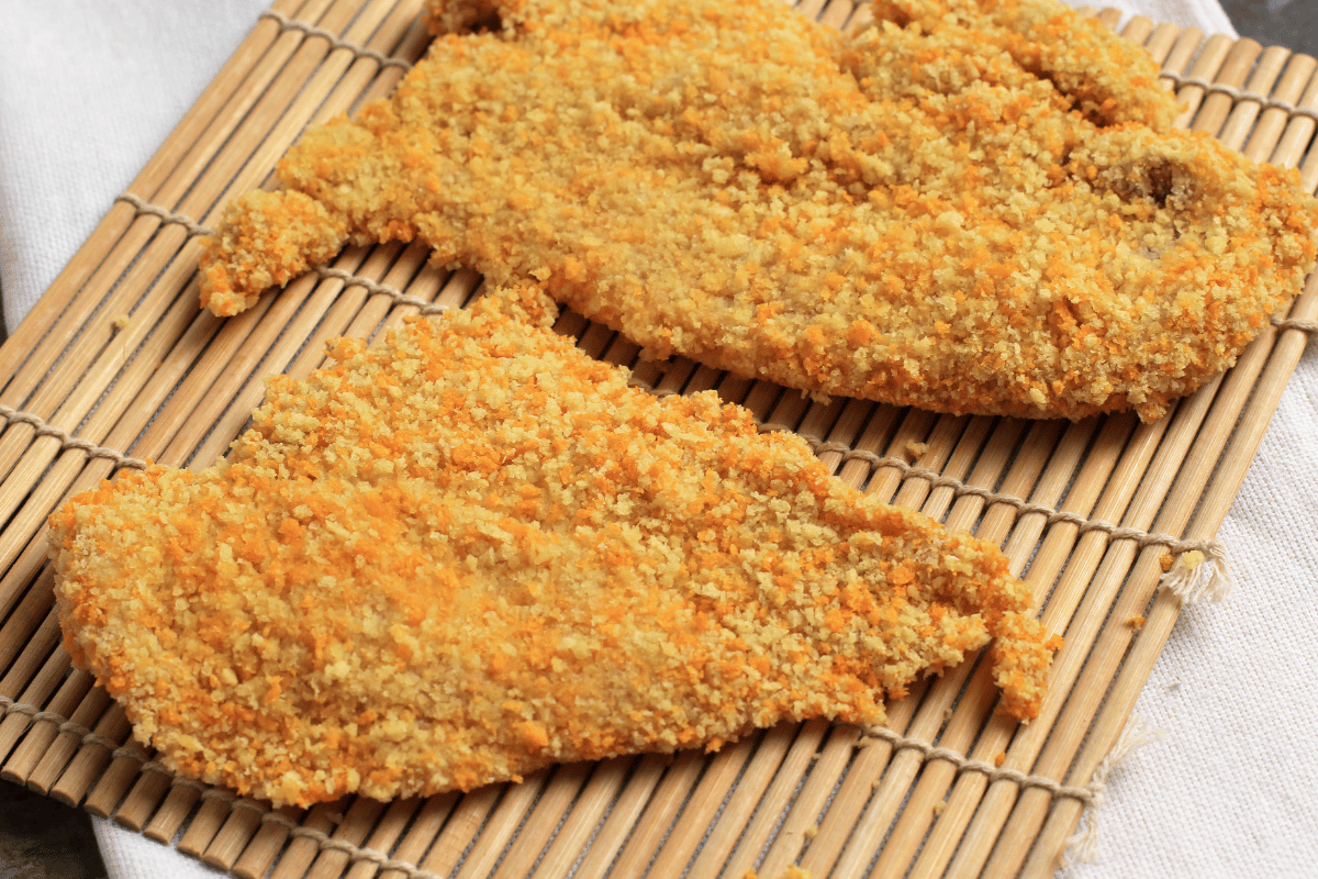 Delicious homemade baked chicken cutlets served with herbs